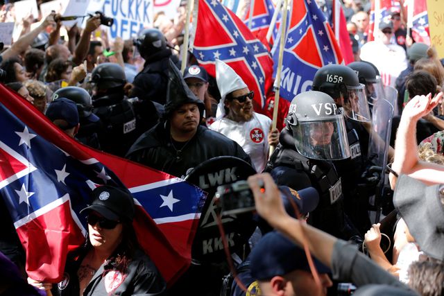 Name:  riot-police-protect-members-of-the-ku-klux-klan-from-counter-protesters-as-they-arrive-to-rally-.jpg
Views: 668
Size:  62.7 KB